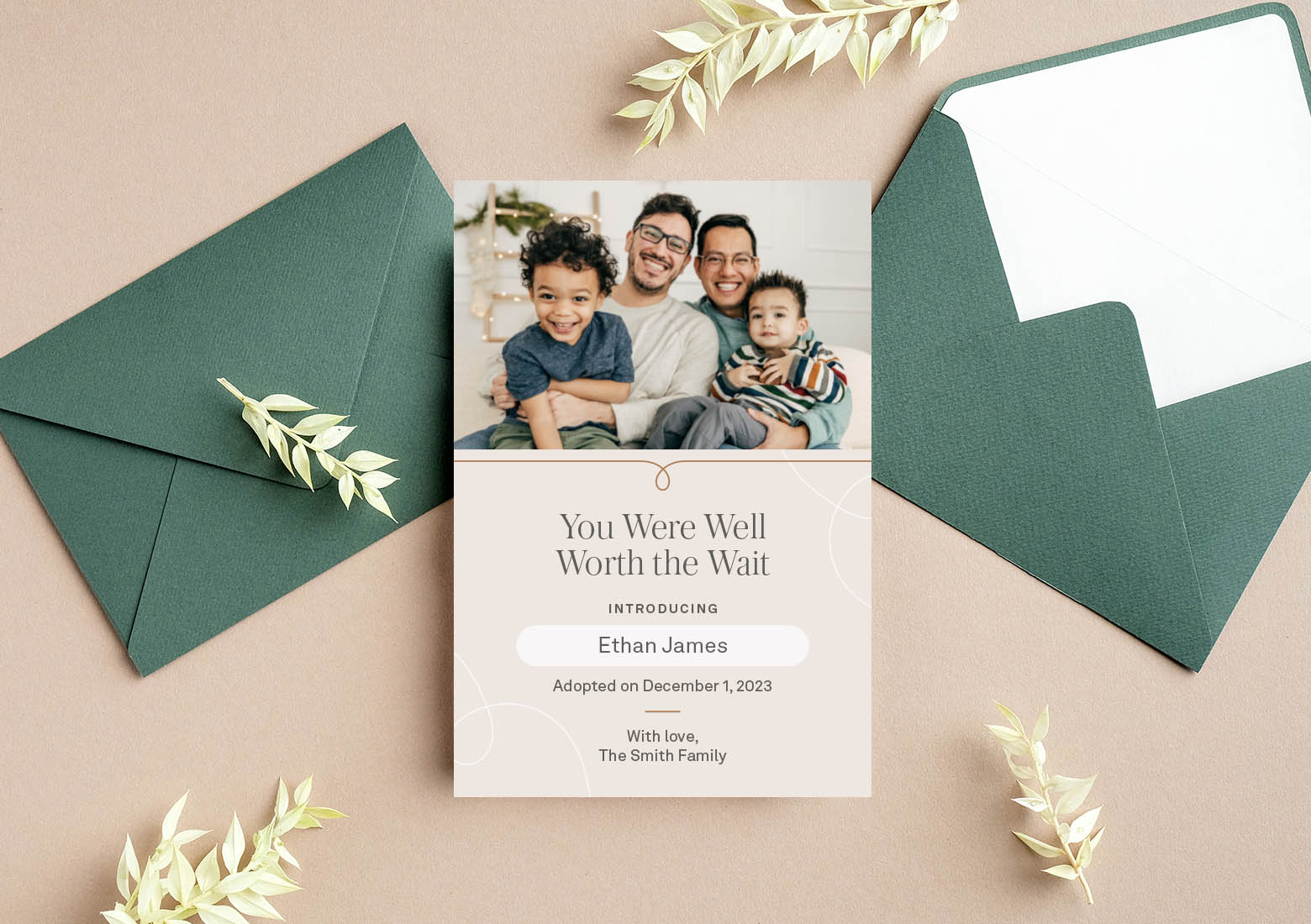 Green envelopes on table with an adoption announcement over top that says you were well worth the wait