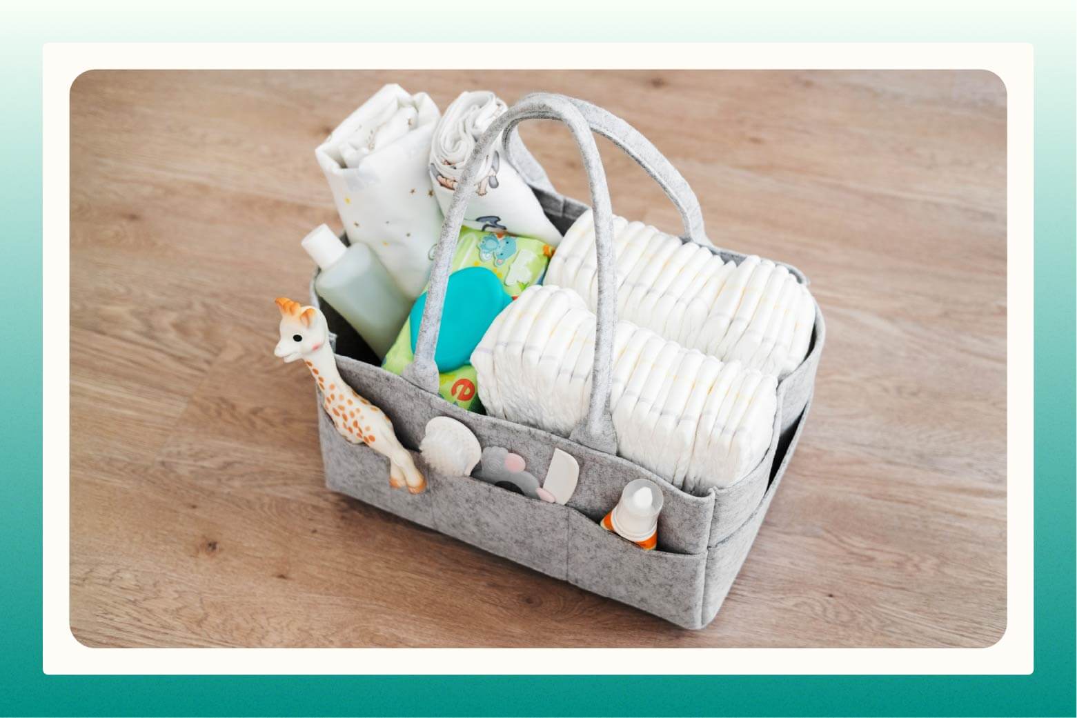 Diaper caddy filled with diapers, wipes, blankets, giraffe toy, brush, comb, and ointments