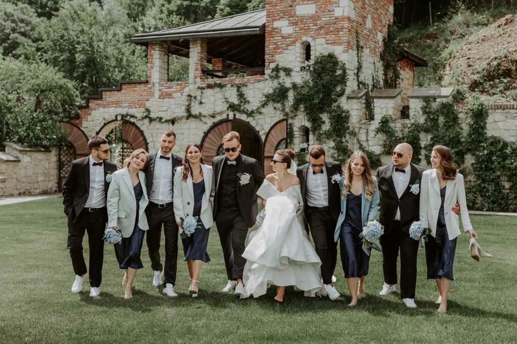 A wedding party walking side by side in an eclectic wedding dress code