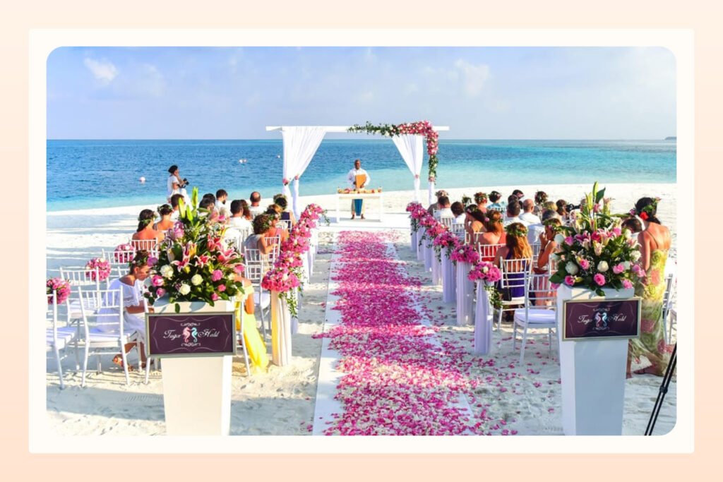 view wedding aisle and ceremony with tropical decor on a beach