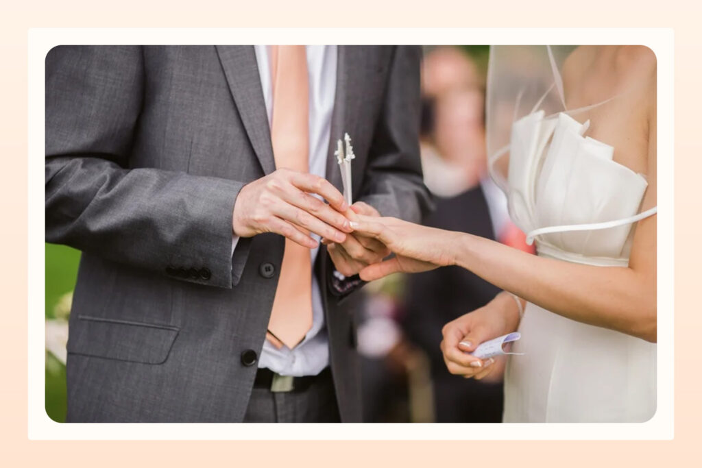 couple exchanging rings during their wedding ceremony 