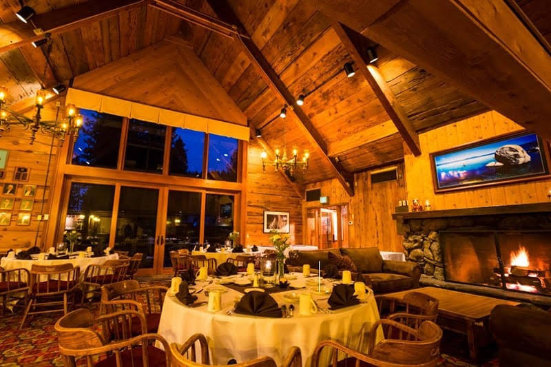 the glowing interior of the granlibakken tahoe that’s set for a wedding reception