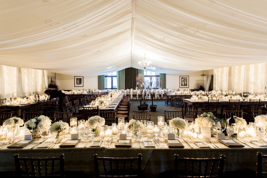 the lodge at plumpjack squaw valley inn set for a wedding reception with white decor