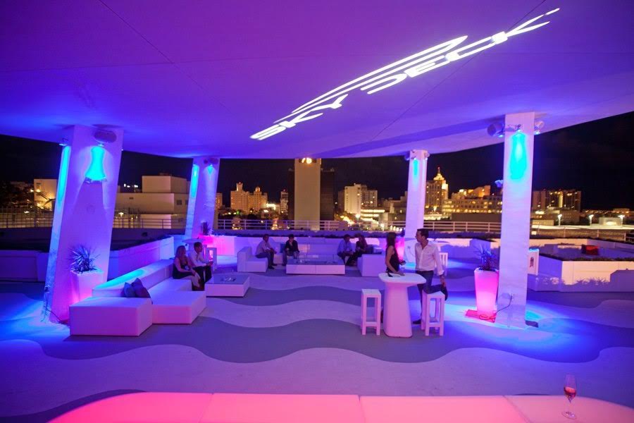 Skydeck Rooftop Miami wedding venue lit up with purple light at night