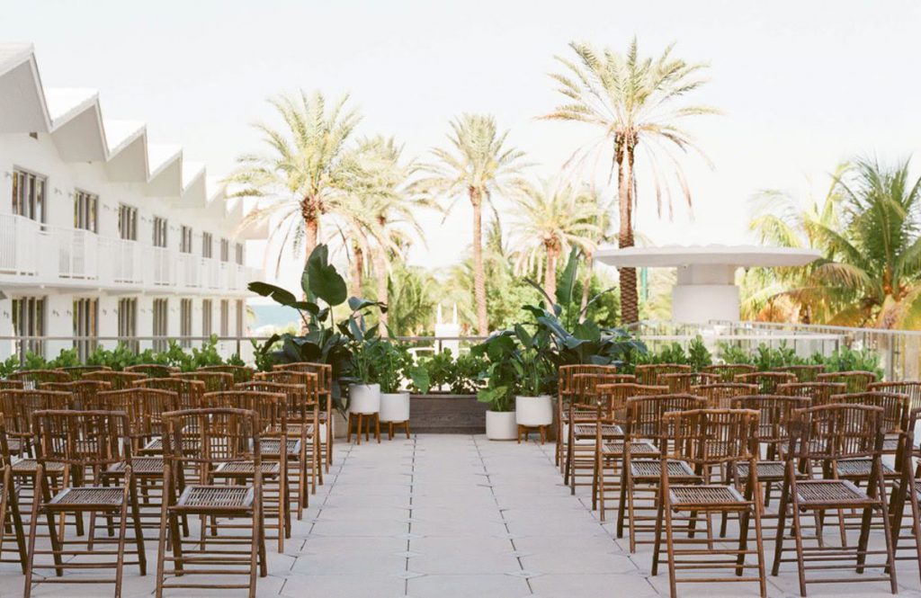 wooden chairs set up for a ceremony on the Sky Terrace at the Shelborne South Beach wedding venue in Miami