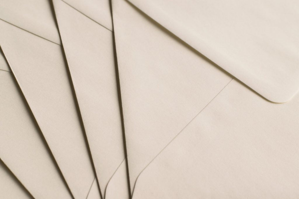 overlapping beige envelopes