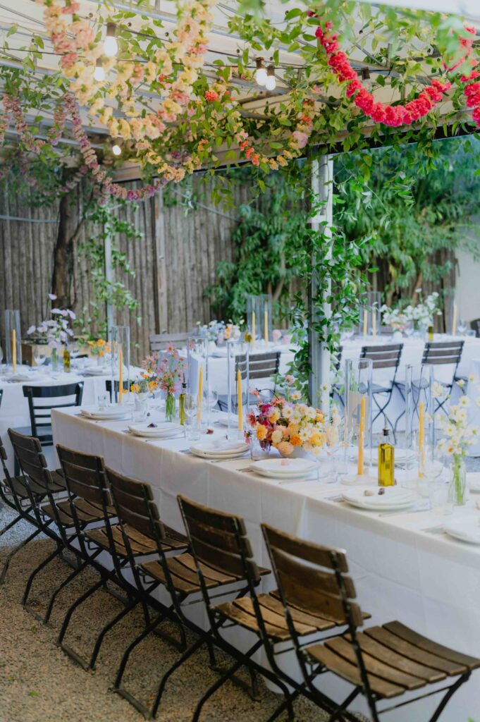 outdoor garden wedding with tables and colorful florals