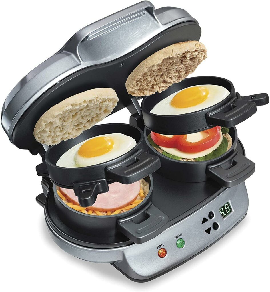 Hamilton Beach Dual Breakfast Sandwich Maker shows a sandwich being assembled