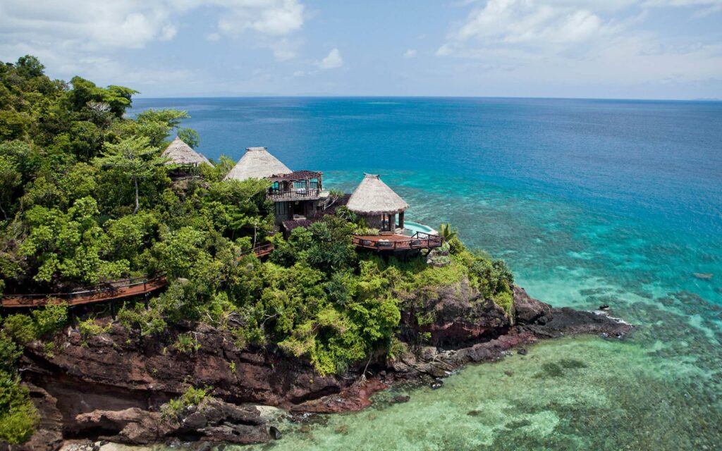 Clifftop bungalows overlooking the ocean on Laucala Island on Fiji