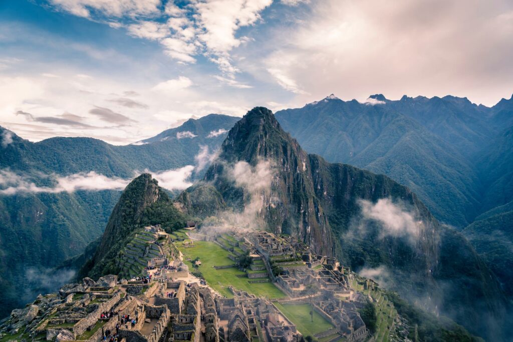 An aerial view of mountains and clouds at Machu Picchu in Peru