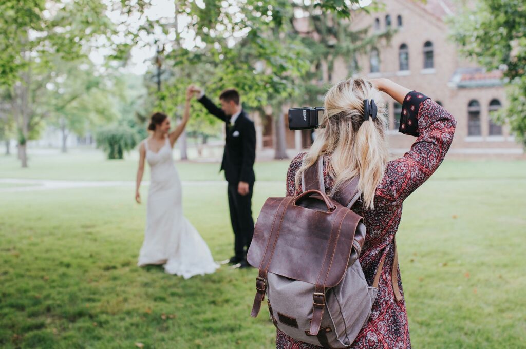 Photographer capturing an image of newlyweds