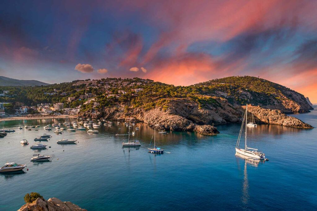 A view of Ibiza's coastline at sunset