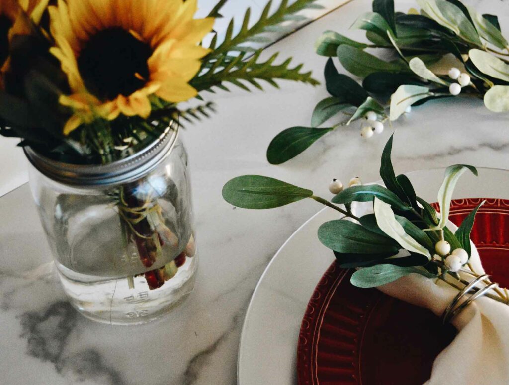 Sunflowers in a mason jar vase add a joyful feel to a couple’s special day