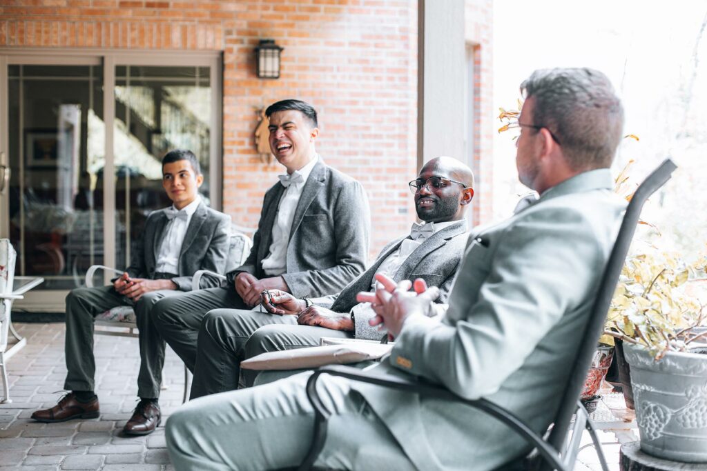 A groom and three groomsmen in his wedding party