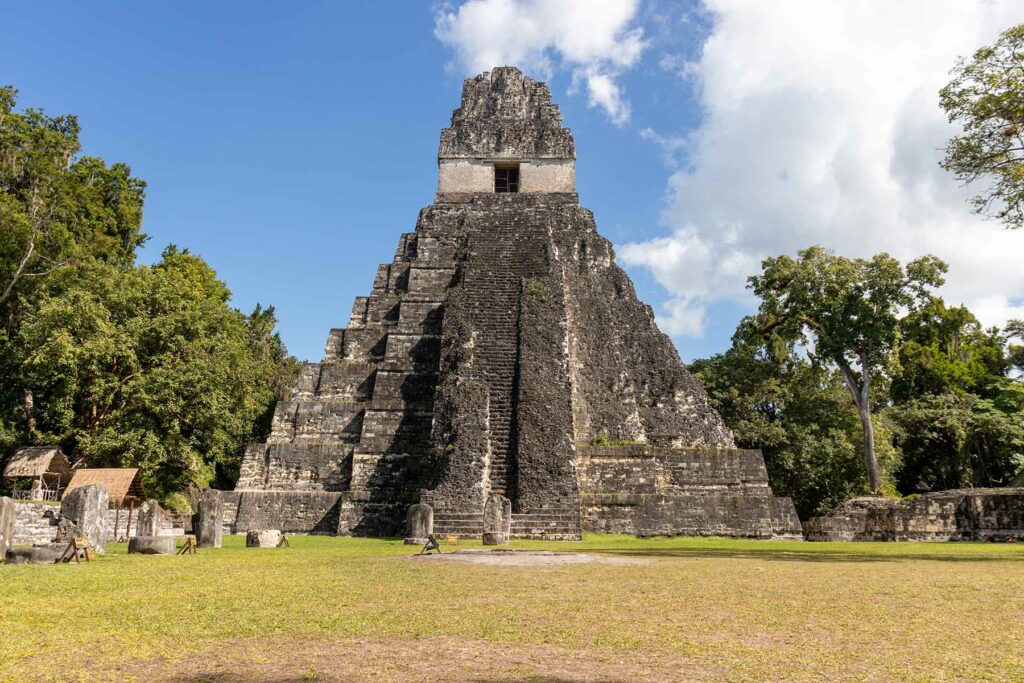 The ancient ruin of Tikal surrounded by trees in Guatemala 