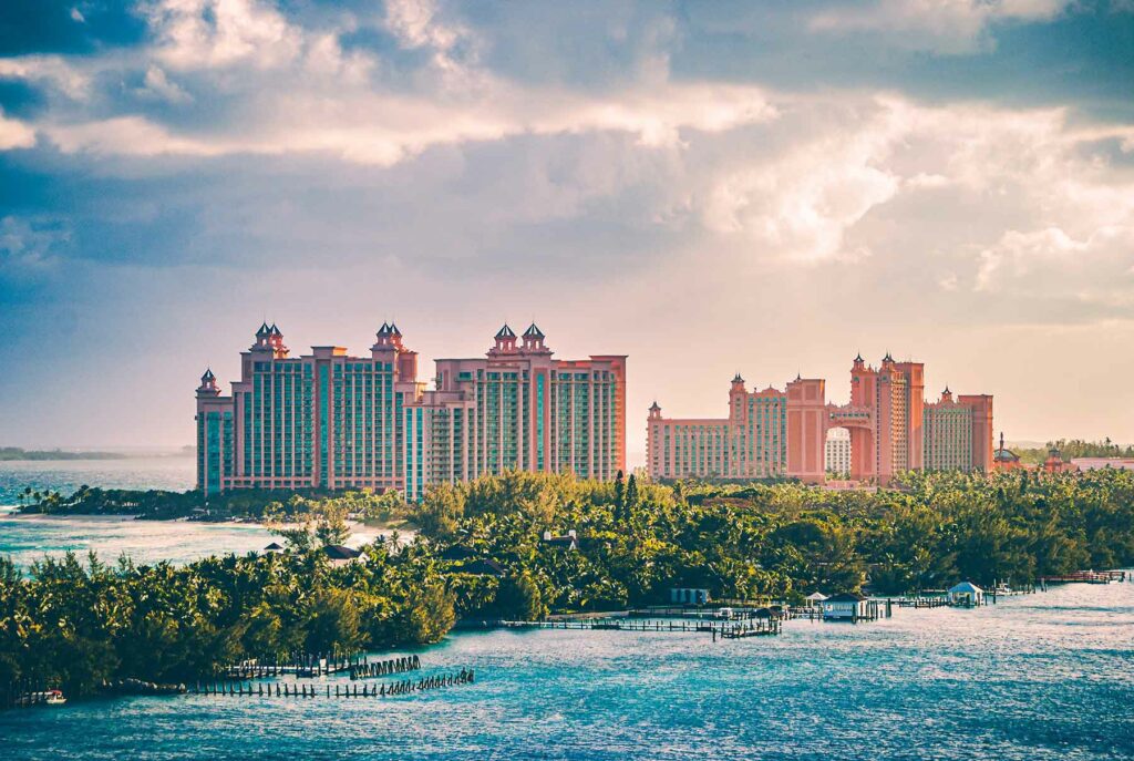 A view of the sprawling Atlantis Resort surrounded by sparkling turquoise waters, a stunning Bahamas destination wedding venue
