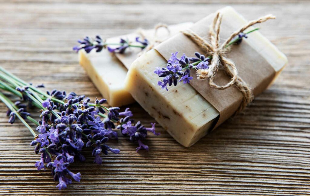 Wedding favor gift idea: Two handmade soap bars wrapped with twine and tied with a sprig of lavender