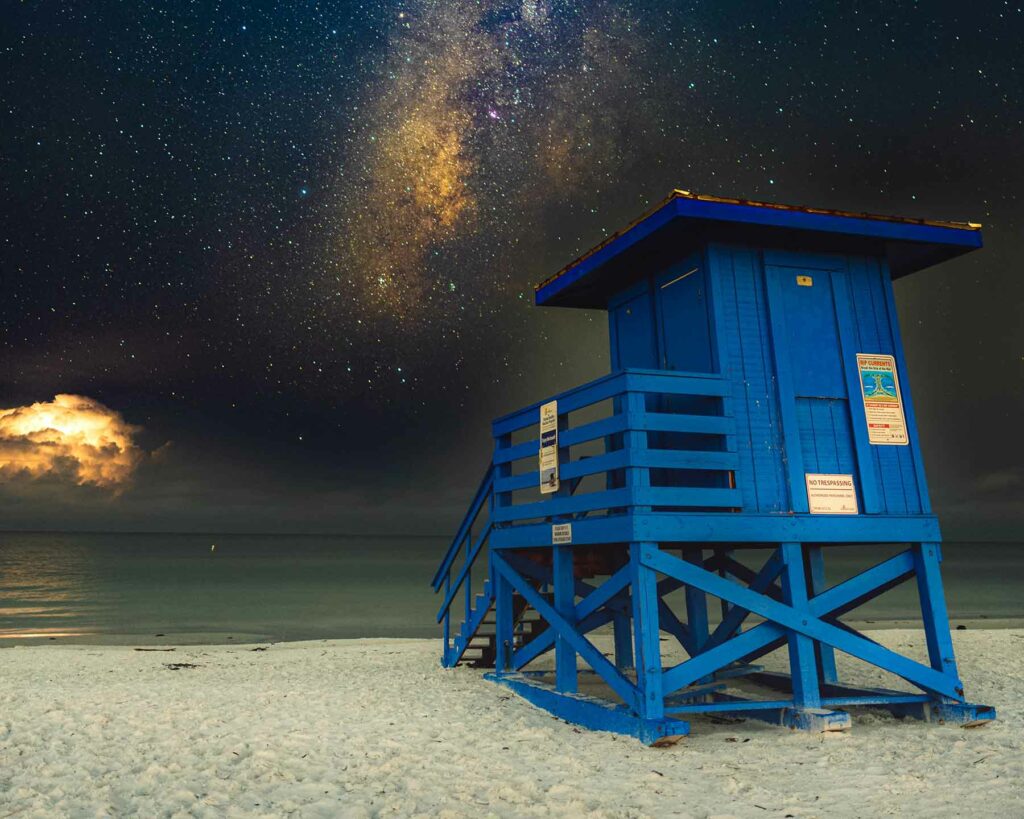 A lifeguard tower in Siesta Key, Florida with a starry sky, one of the best places to propose in the U.S.