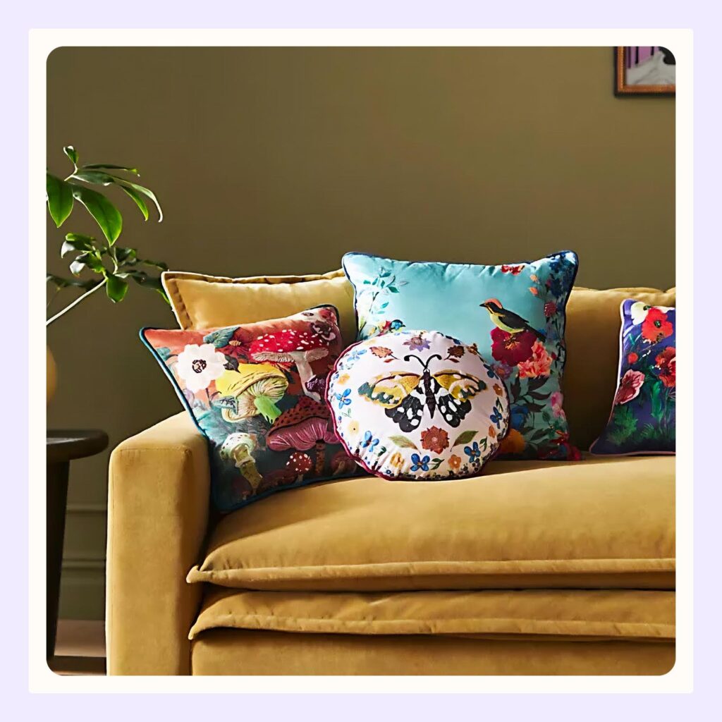 decorative pillows on a yellow couch