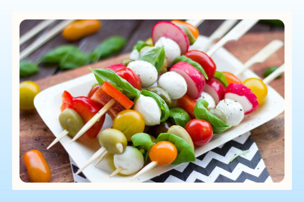 fruits and vegetables on skewers at wedding reception