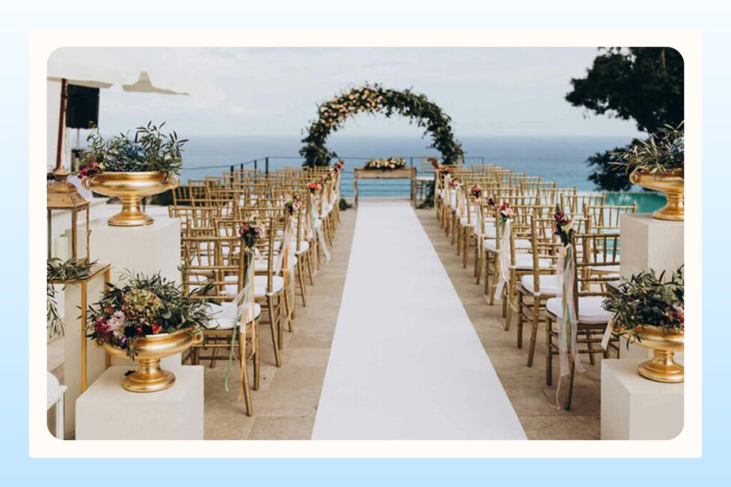 outdoor white wedding venue with ocean view