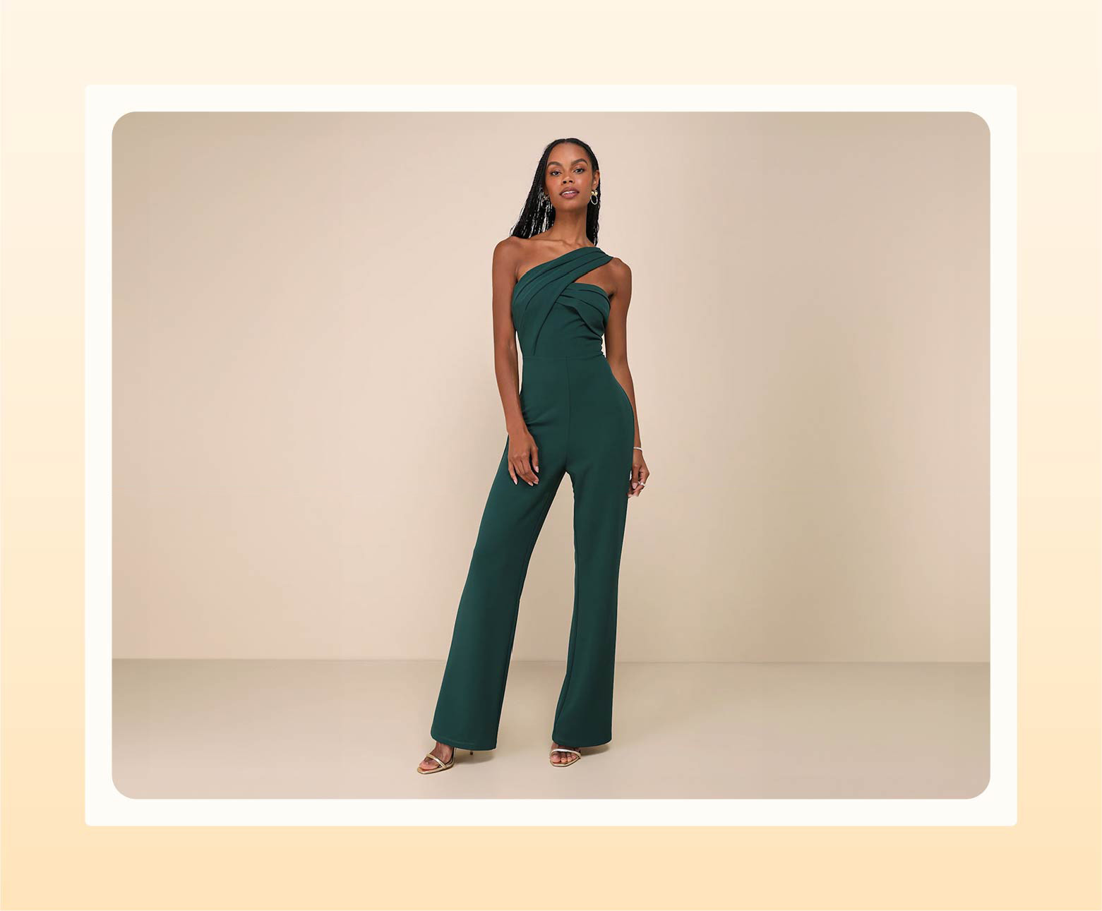 Model wearing a one-should green jumpsuit as semi-formal wedding attire