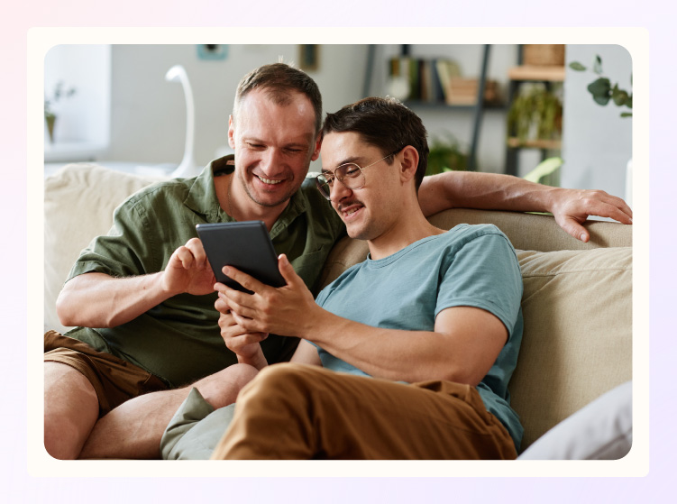 Engaged couple planning their wedding budget on the computer