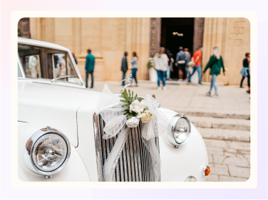 A white vintage wedding rental car