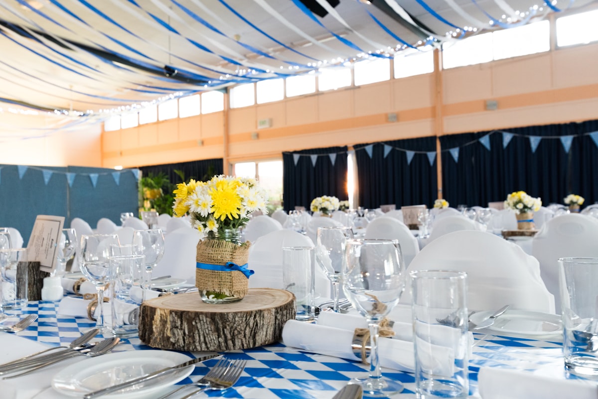 Wedding reception with round tables and guests seated for dinner