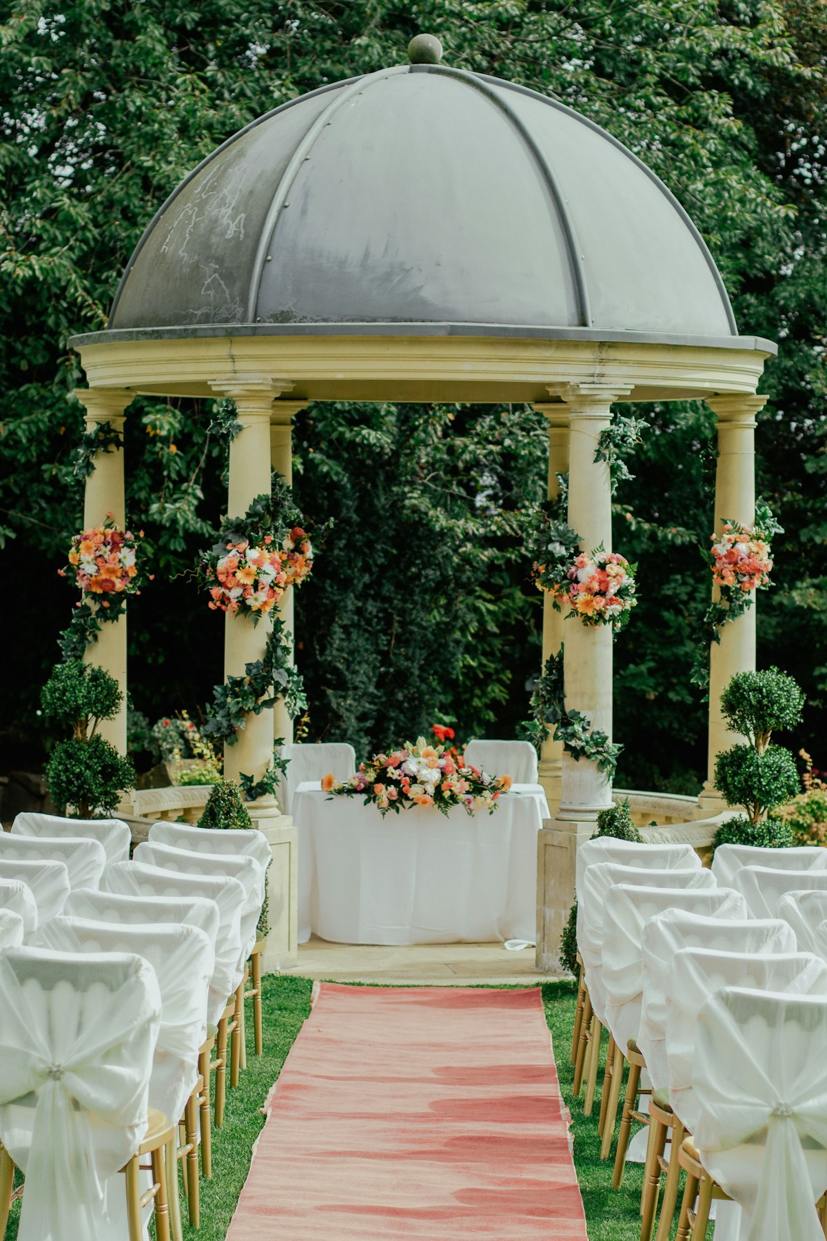 A beautifully arranged wedding favor display table with personalized gifts