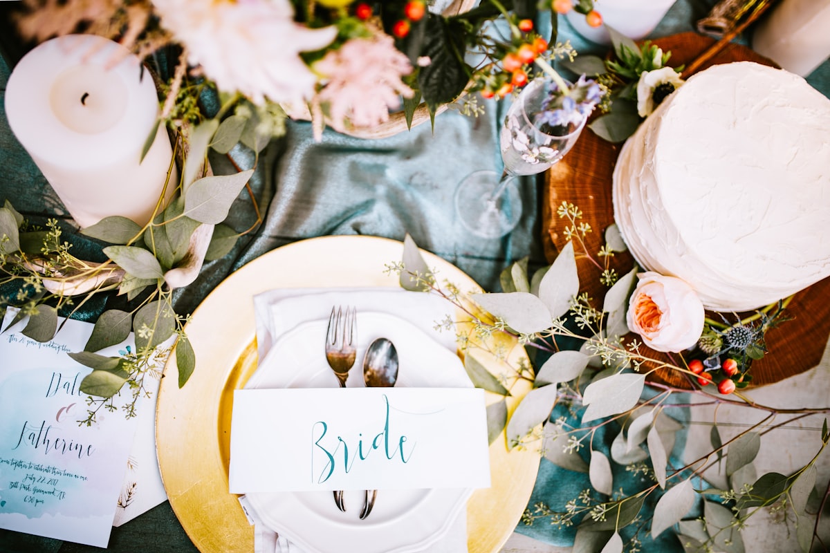 Outdoor wedding table setup surrounded by natural greenery and sustainable decor