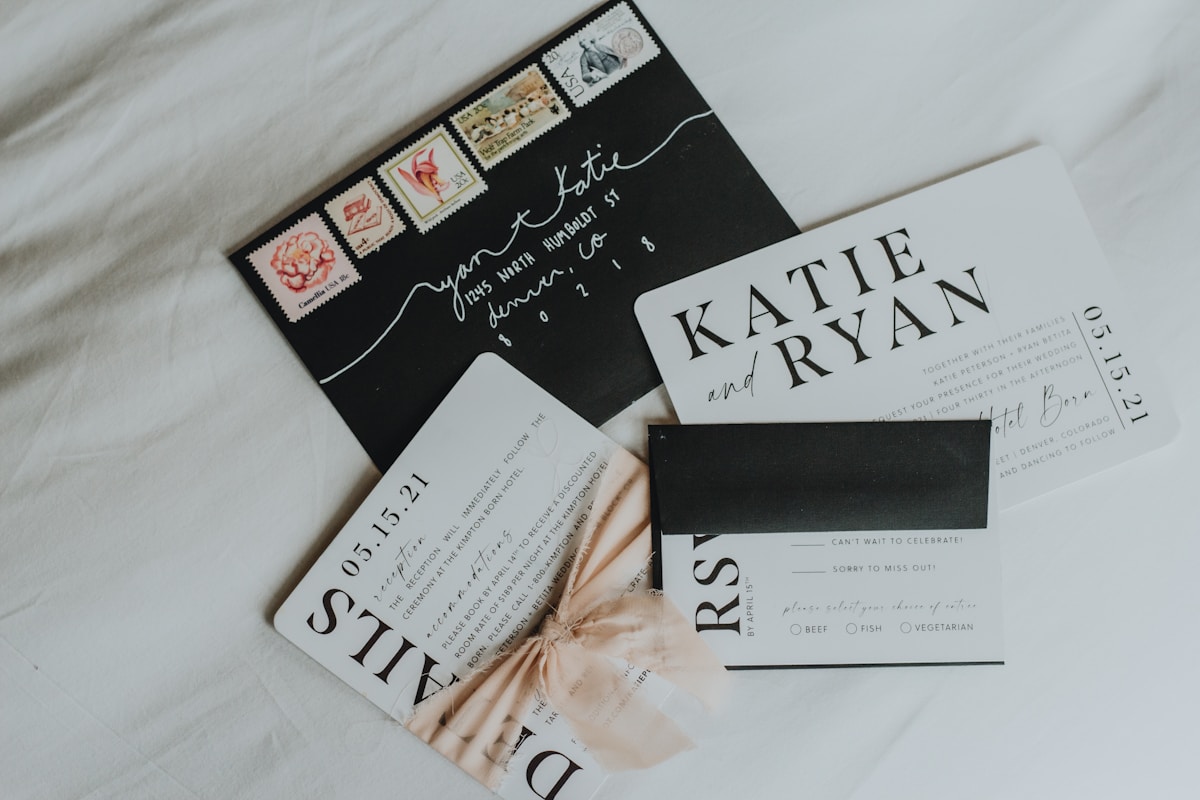 Formal wedding invitation suite with couple's names in classic serif type