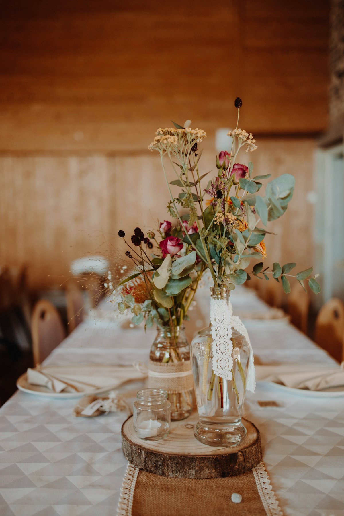 Wildflower arrangement on a rustic wedding table setting